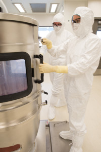 BioMARC production supervisor Brandon Marsh and production associate Nicole Kelly calibrate a bioreactor.