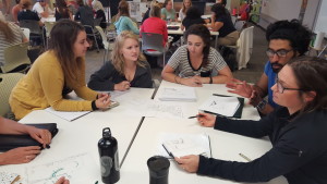 Interior design students talk with CASA staff at one of the design charrettes.