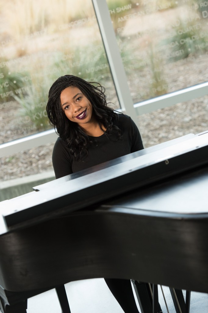 Jada Boyd, Junior Biomedical Sciences major, plays the piano in the Lory Student Center Theatre lobby. December 9, 2015