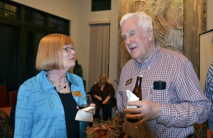 Louann Reid, head of the Department of English, speaks with a Great Conversations member at the Feb. 9 event.