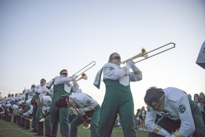 The trombone section performs No. 5 at the Homecoming and Family Weekend pep rally