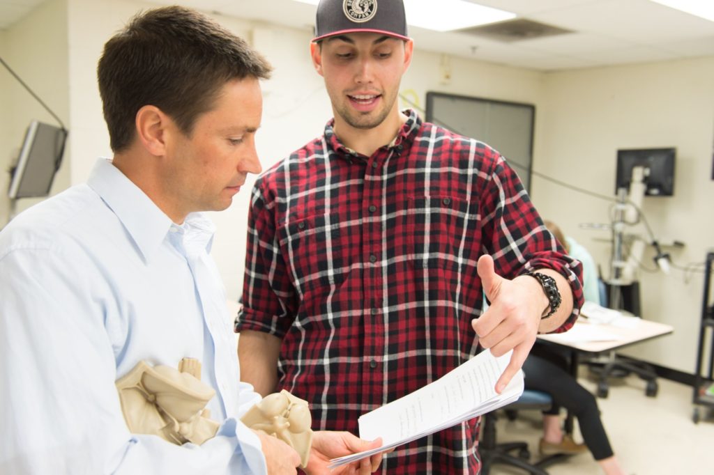 Colorado State University Biomedical Sciences assistant professor Tod Clapp works with students in his BMS 345 Functional Neuroanatomy class, March 22, 2016.