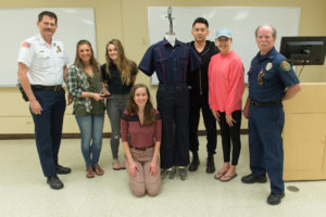Team Marvel is presented with First Place for their redesign of Firefighter uniforms as part of an AM 376 Class project. May 11, 2016