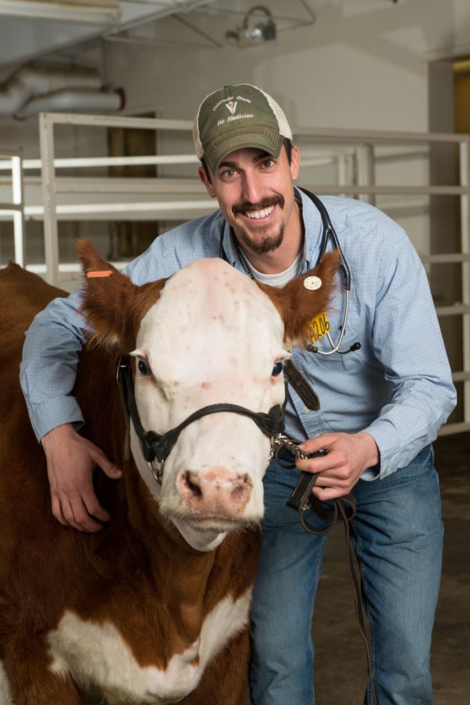 Dr. Nick Lemmel pictured with cow