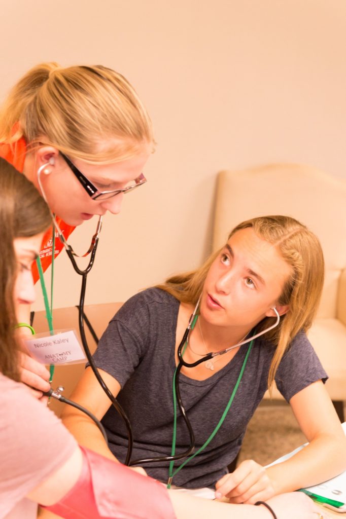 High school students learn how to take blood pressure readings at Colorado State University's Anatomy Camp taught by Biomedical Sciences students, July 12, 2016.