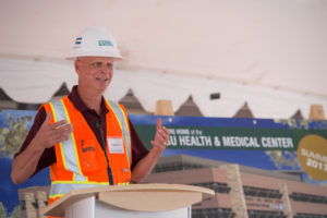 Doug Johnson, Vice President, Adolfson and Peterson Construction, delivers remarks at the Topping-Out Ceremony for Colorado State University’s Health and Medical Center. August 1, 2016
