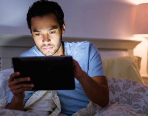 Man reading from tablet