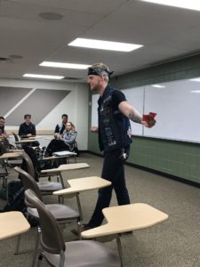 Male student dressed up as one of the ideologies