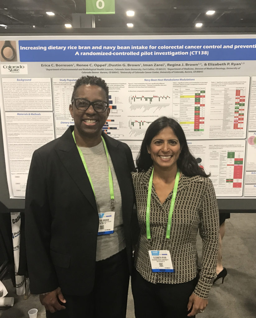 Dr. Regina Brown of UCHealth, left, and CSU researcher Elizabeth Ryan prepare for their poster presentation at the American Association for Cancer Research 2017 meeting in Washington, D.C.