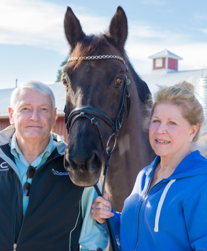 John and Leslie Malone pose with Maikel at Harmony Sporthorses, December 2, 2014.