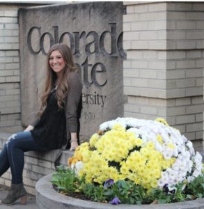 Portrait of Taylor Sloan in front of CSU sign