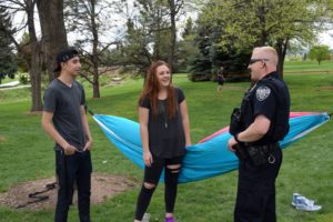 A CSUPD officer interacts with students on campus.