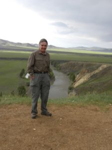 Robin Reid standing on the banks of the Orkhon River, Bat Ulziit, Mongolia.