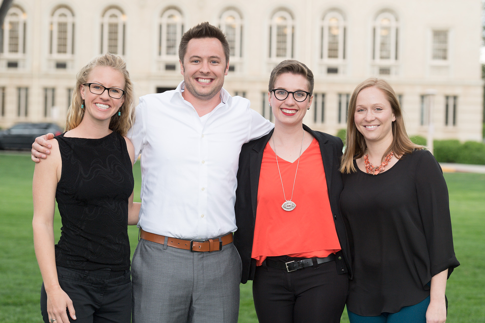 Charlie Warden stands with his Global Social and Sustainable Enterprise MBA teammates