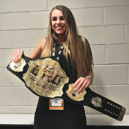 Rylee Causey holding a belt