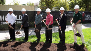 color photo of CSU leaders, construction reps with shovels at groundbreaking for the Health Education Outreach Center