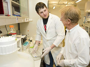 Patrick Brennan works with undergraduate Jason Bradshaw on separating the  antigens  used to diagnose tuberculosis.