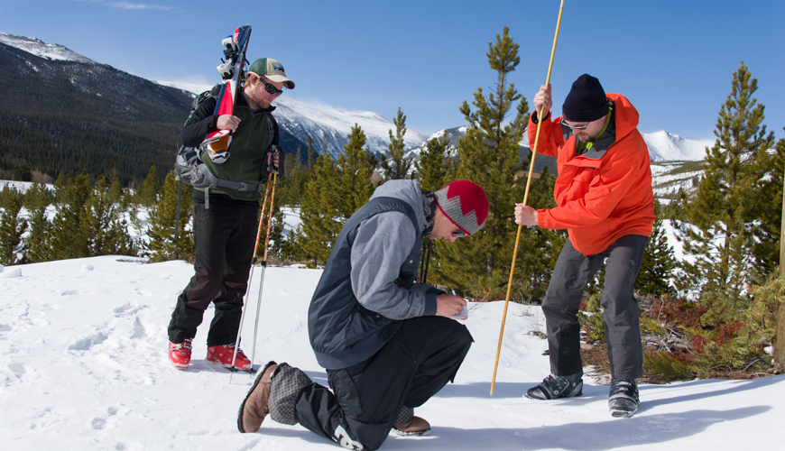 A team from CSU's Ecosystem Science and Sustainability department take measurements on a snow survey in the Cache la Poudre River basin.