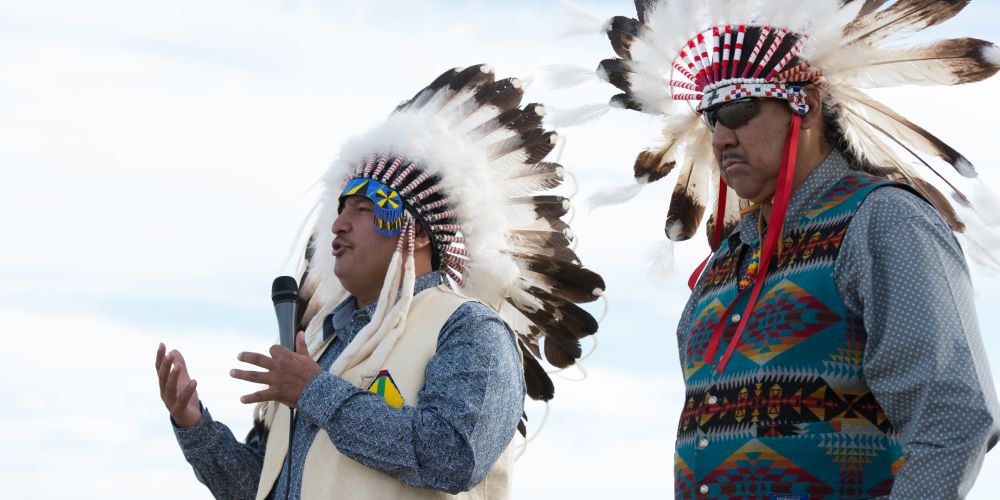 two tribal leaders in headdresses