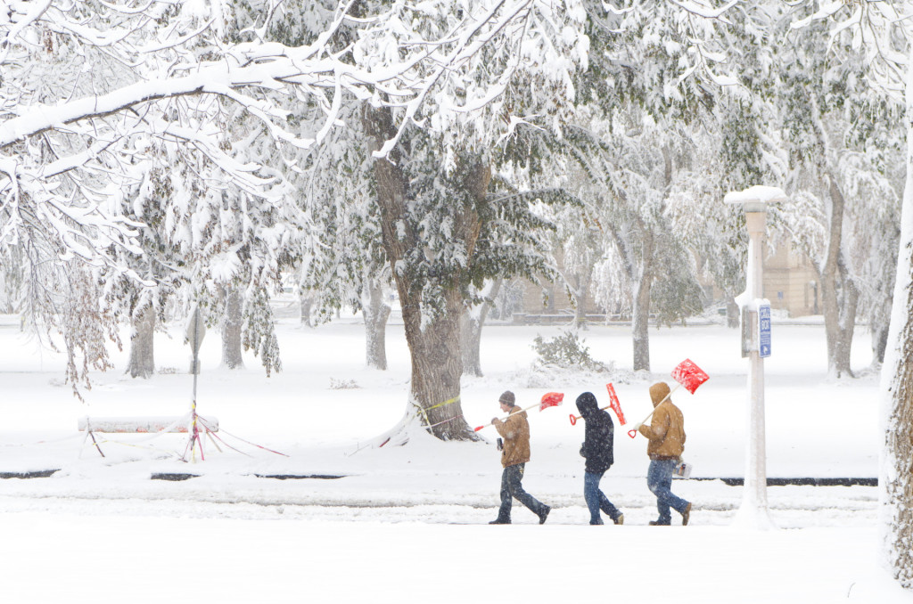 A Facilities crew walks on The Oval as they shovel snow, November 3, 2011