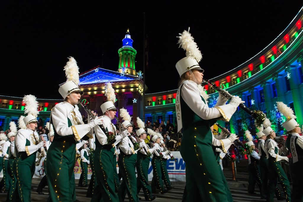 Marching band in front of Denver City and County Building at night