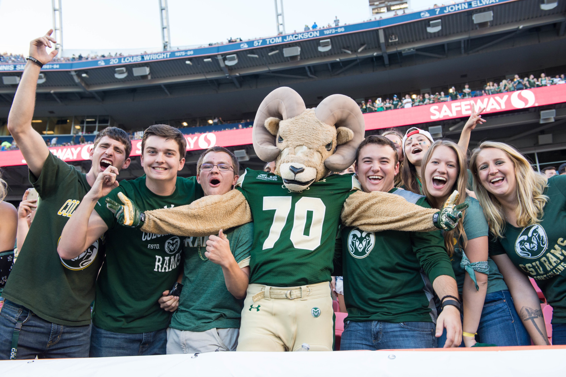 CAM the Ram mascot with students at Mile High Stadium