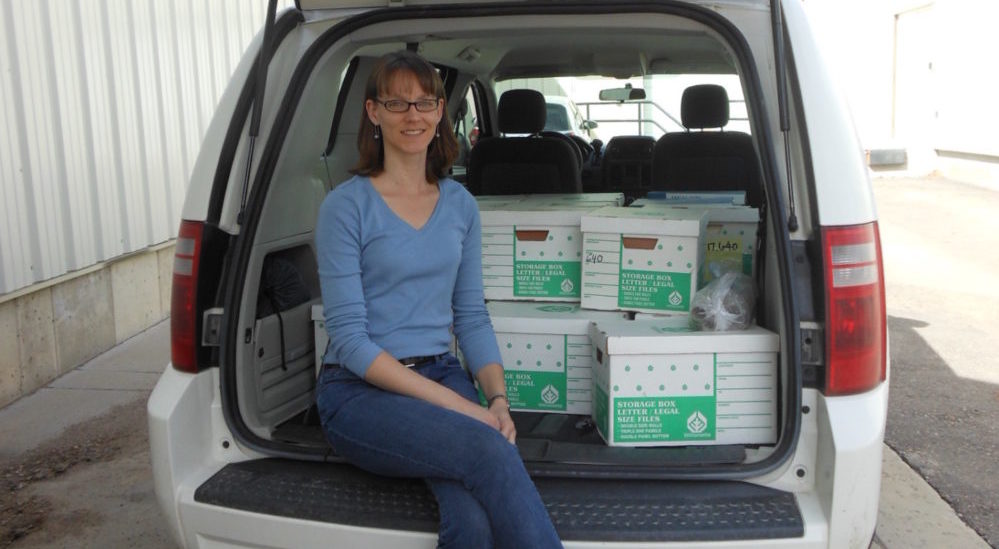 Patty Rettig with boxes in a hatchback