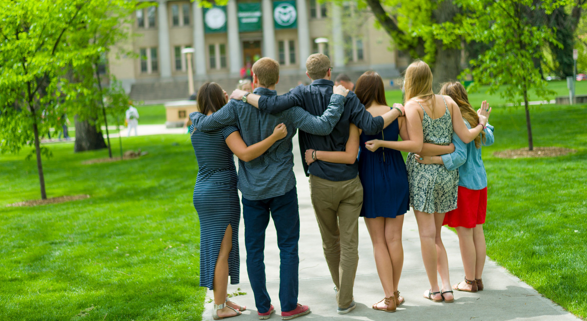 Graduating students gather with friends and family on the Colorado State University Oval in preparation for commencement ceremonies.