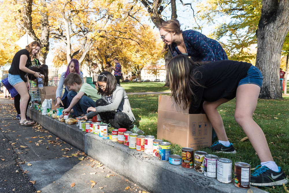 Lesher Middle School students place food items at the 31st annual Cans Around the Oval food drive for the Food Bank for Larimer County, October 18, 2017.
