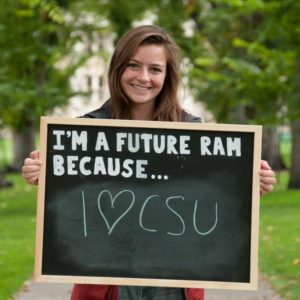 A future Ram hold an I love CSU sign