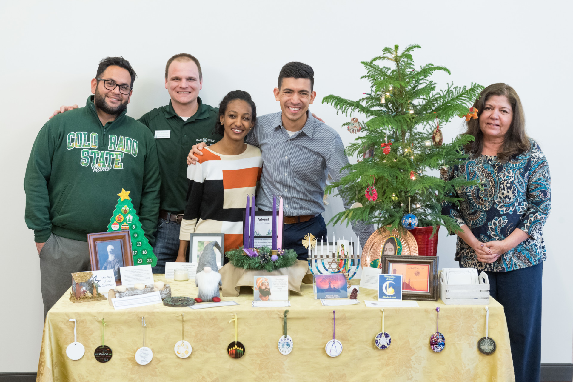 Decorating committee with inclusive holiday display at Collaborative for Student Achievement at Colorado State University.