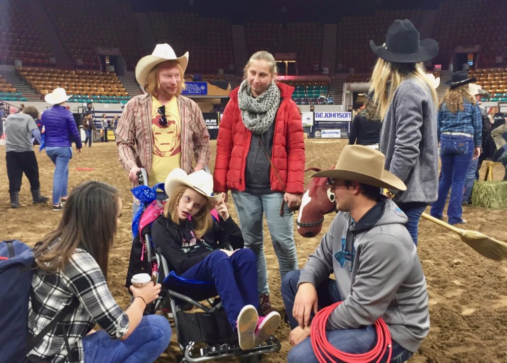 Exceptional Rodeo participant from The Joshua School with cowboy, teachers, and chaperones.
