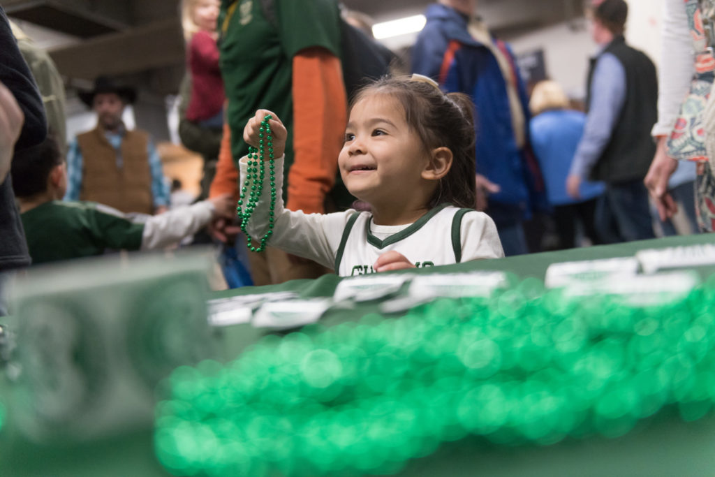 Little girl with beads at CSU booth