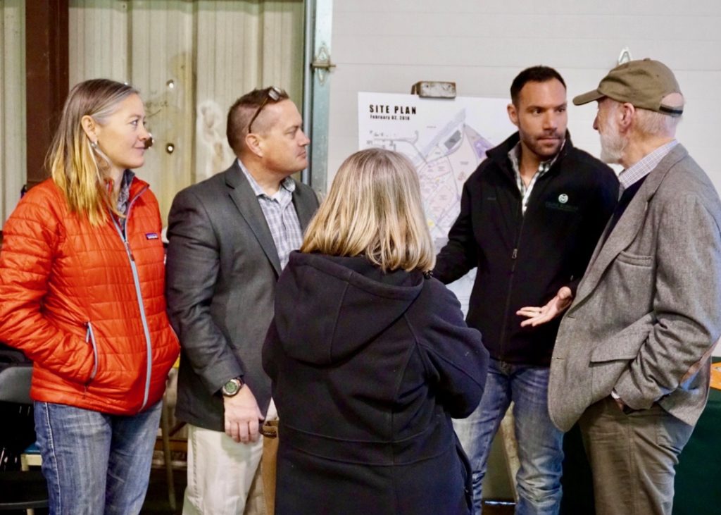 Adam Daurio explains plans for Animal Health Building at the future National Western Center to attendees during Temple Grandin Equine Center Open House.