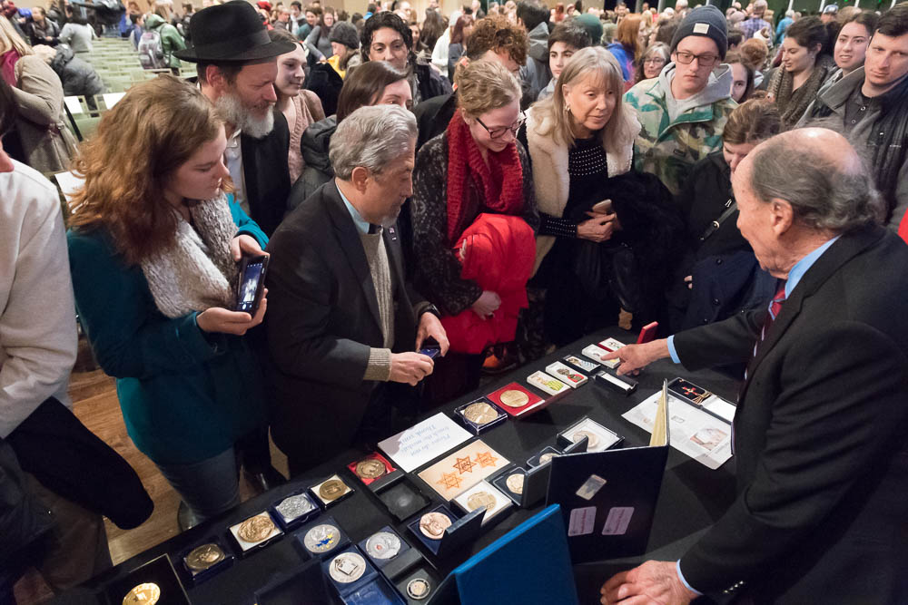 Major Cohn, right, describes the many medals and commendations his wife and Marthe Cohn received for her work as a spy for the French Army during World War II. Marthe Cohn spoke of her experiences at a Holocaust Awareness Week event at Colorado State University, February 22, 2018.