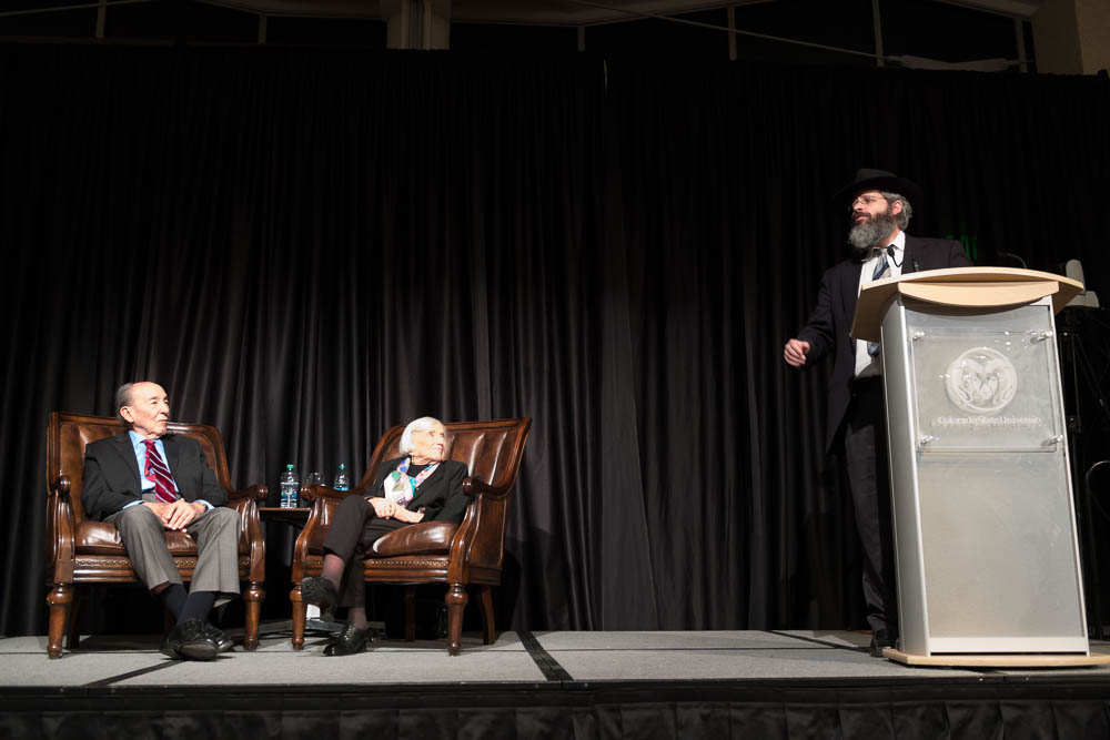 Rohr Chabad Jewish Center of Northern Colorado director and faculty advisor for several Colorado State University Jewish student groups Rabbi Yerachmiel Gorelik introduces Marthe Cohn at a Holocaust Awareness Week event, February 21, 2018.