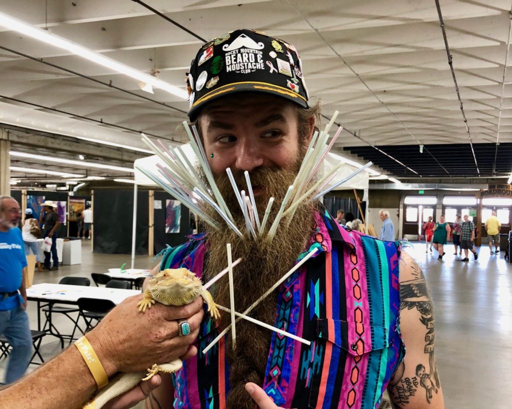 Denver 4-H's bearded dragon, Clem, next to winner of beard contest at 2018 Denver County Fair.