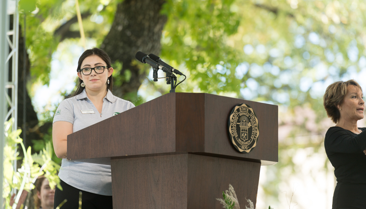 Milena Castaneda at podium