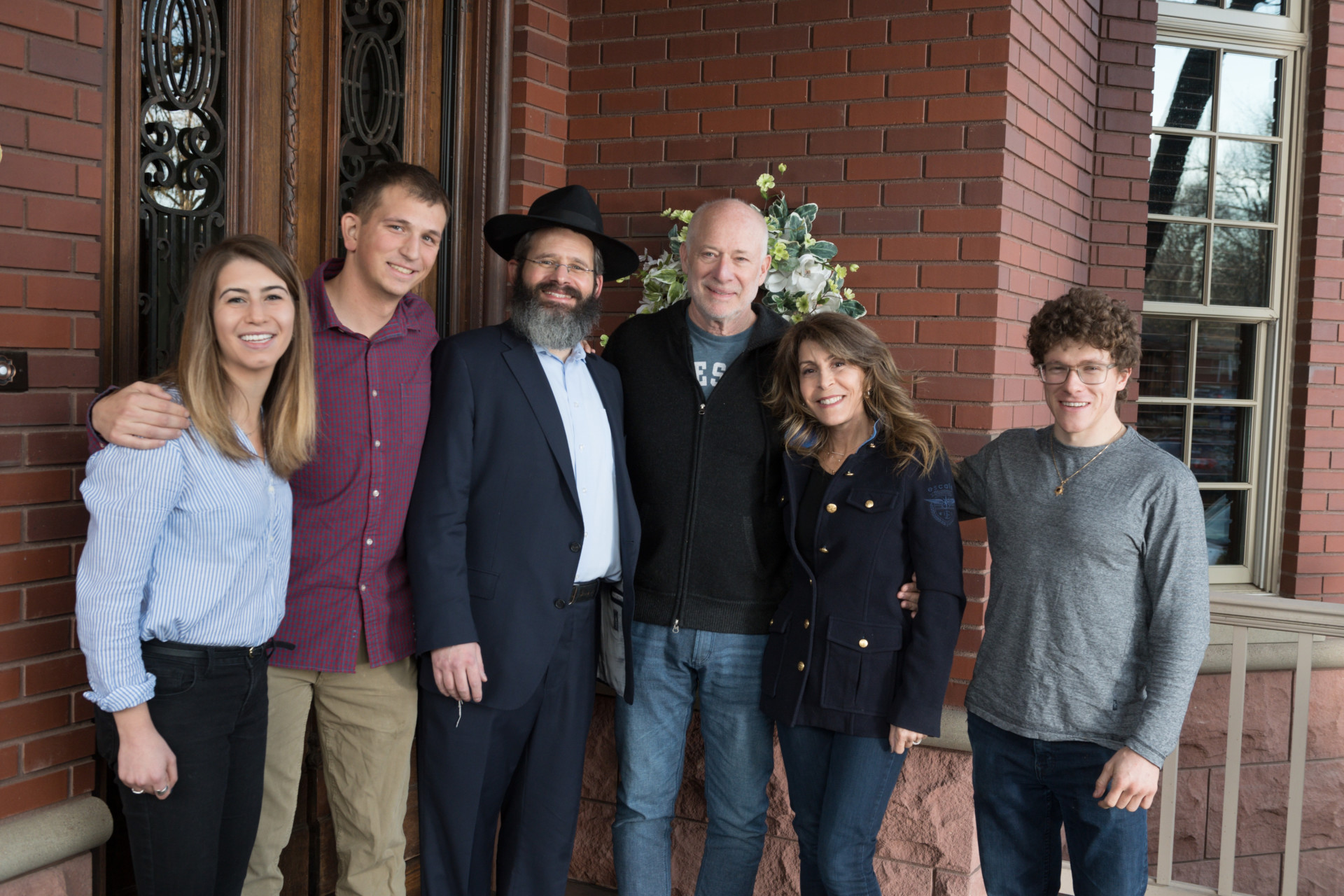 Chabad Jewish Student Organization President Sarah Convissar, Vice President Eric Umans, Rabbi Yerachmiel Gorelik, Barry and Donna Goldfarb and CSU alumnus Michael Lichtbach pose before Goldfarb’s talk at Shabbat 200