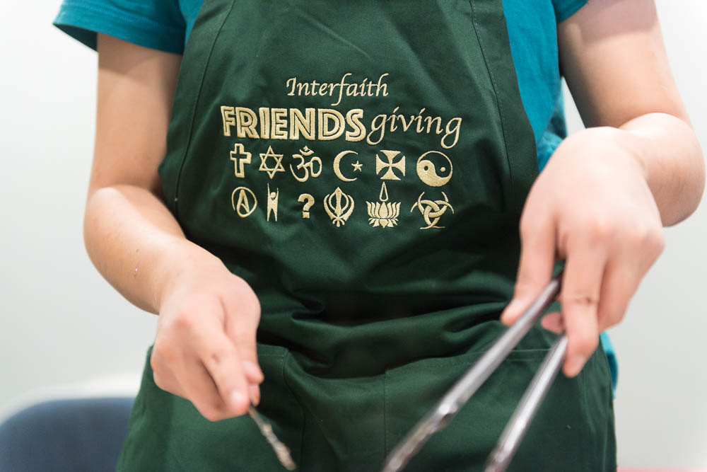 Student in Friendsgiving apron