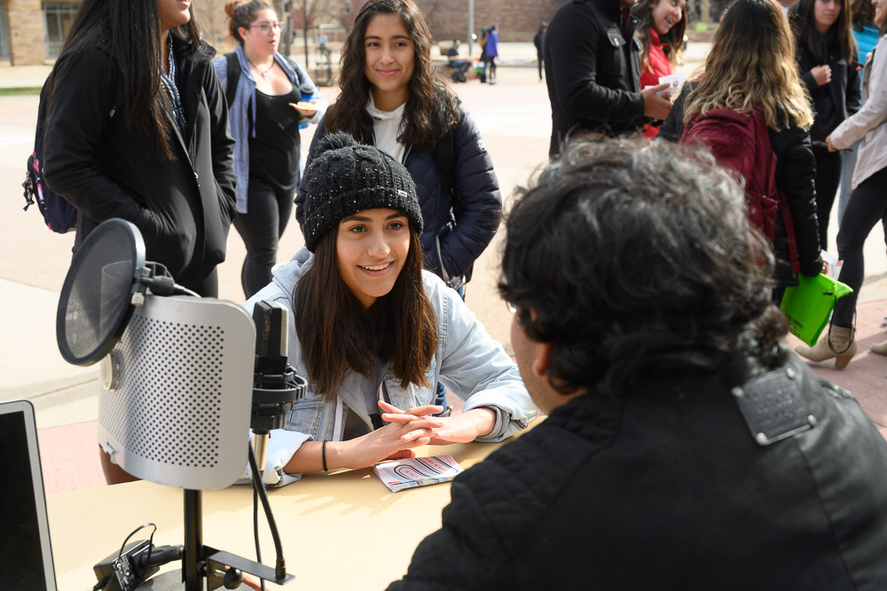 Students interviewing on the plaza