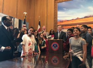Youth FLTI participants see policy making in practice as former Colorado Gov. Hickenlooper signs bill into law.