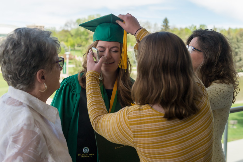 Family fusses over graduate before ceremony
