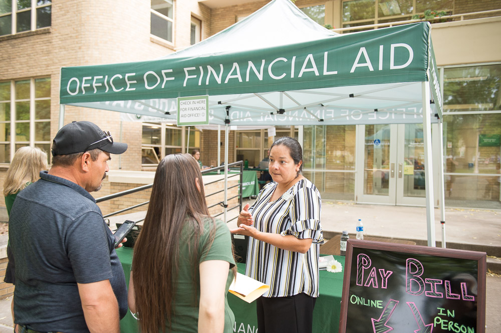 Financial Aid staff talking to parents