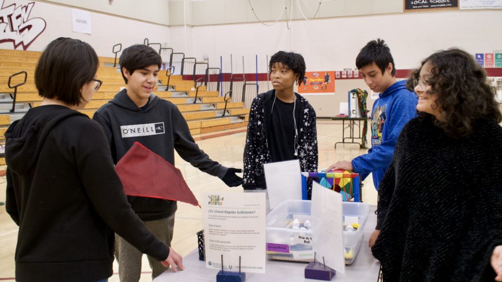 Students participate in Little Shop of Physics science experiments at Bruce Randolph School.