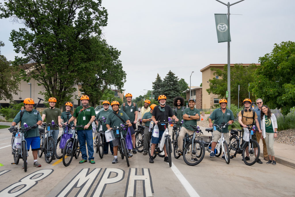 A group of CSU employees with their e-bikes