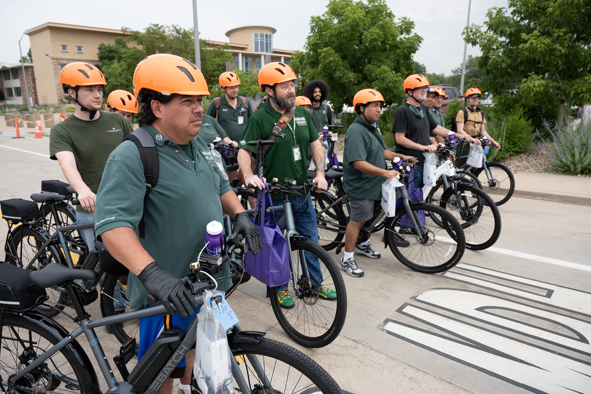 A group of CSU employees with their e-bikes