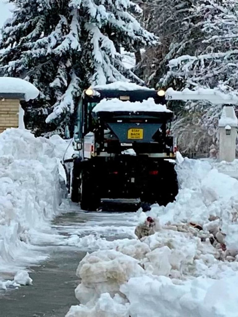 Plow clearing snow