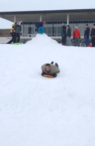 Student sleds outside of LSC