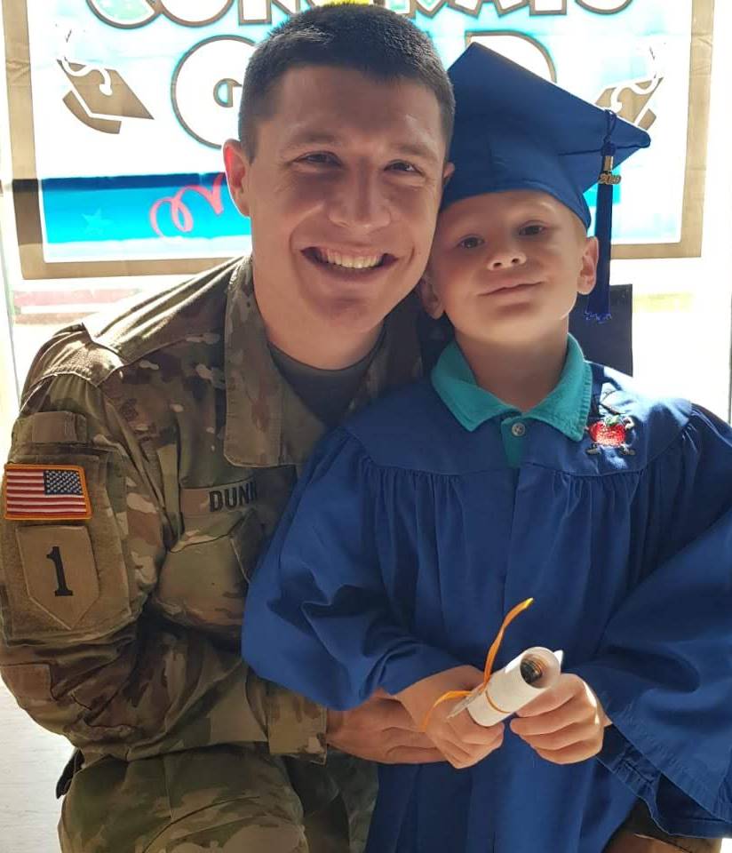 Casey Dunn and his son celebration a graduation together